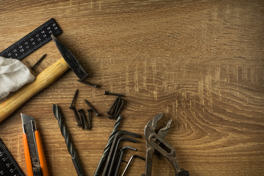Home craftsmans tools lie on a wooden board
